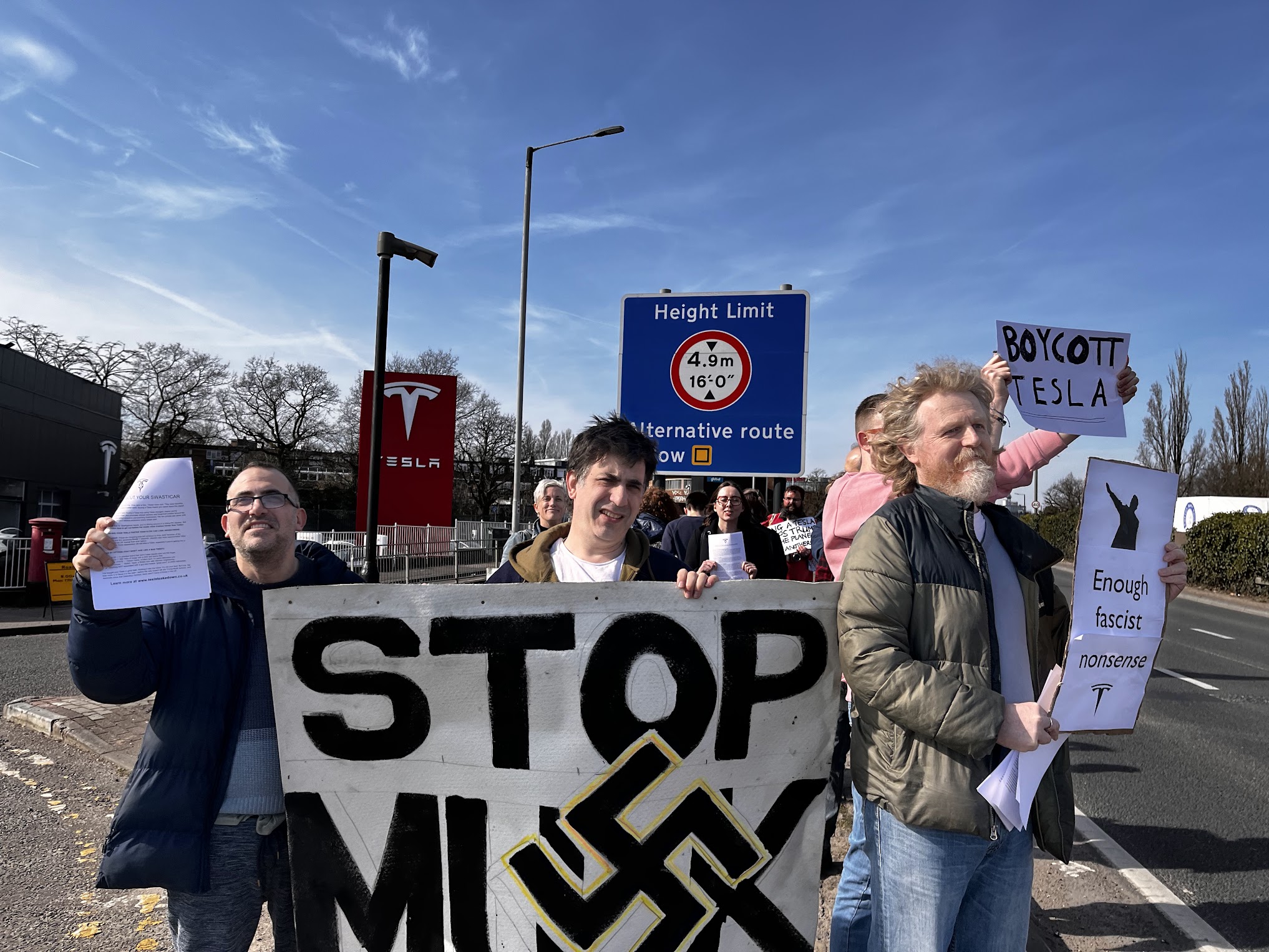 A scrappy group of protesters along the A40 protesting Musk