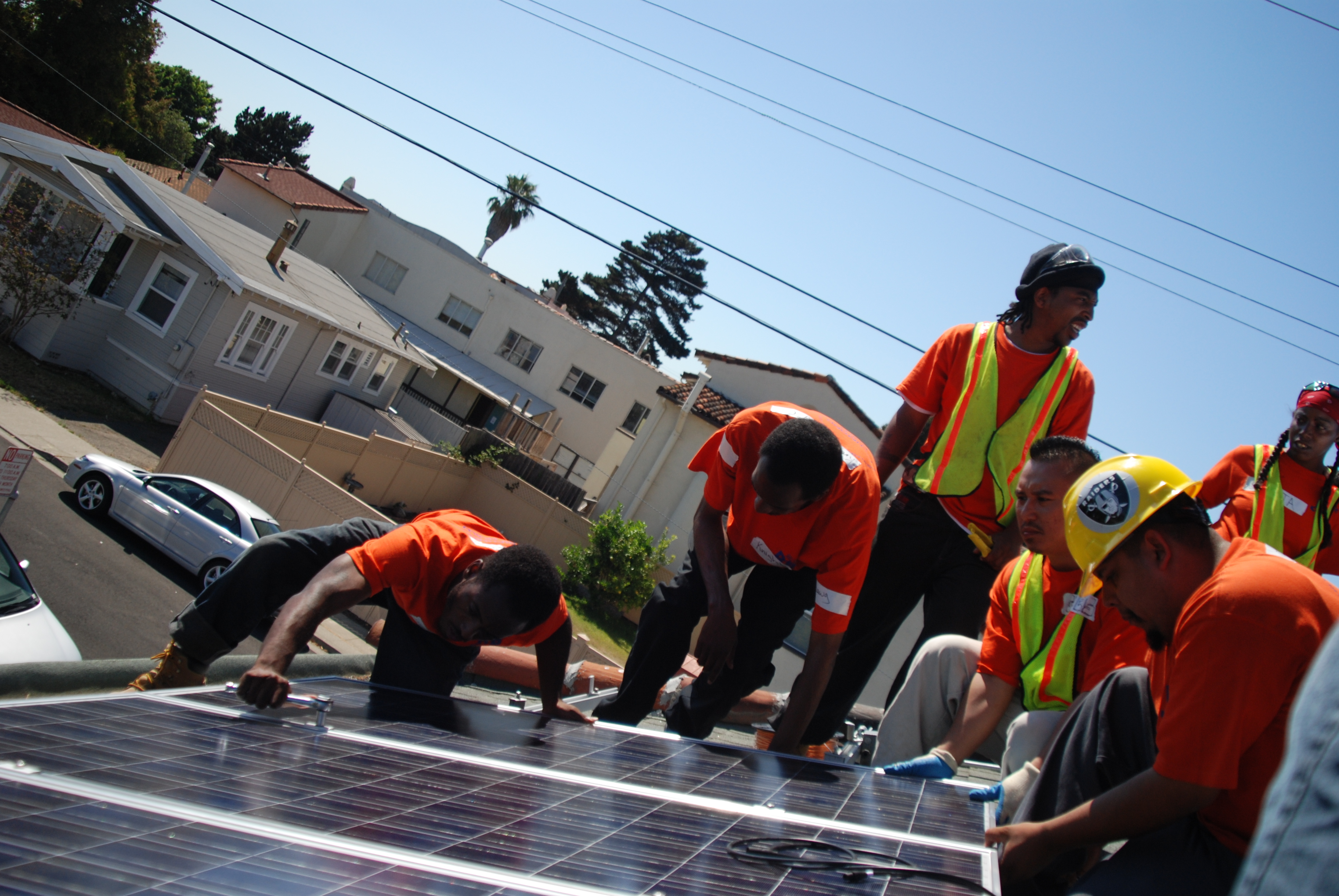 Workers installing solar panels