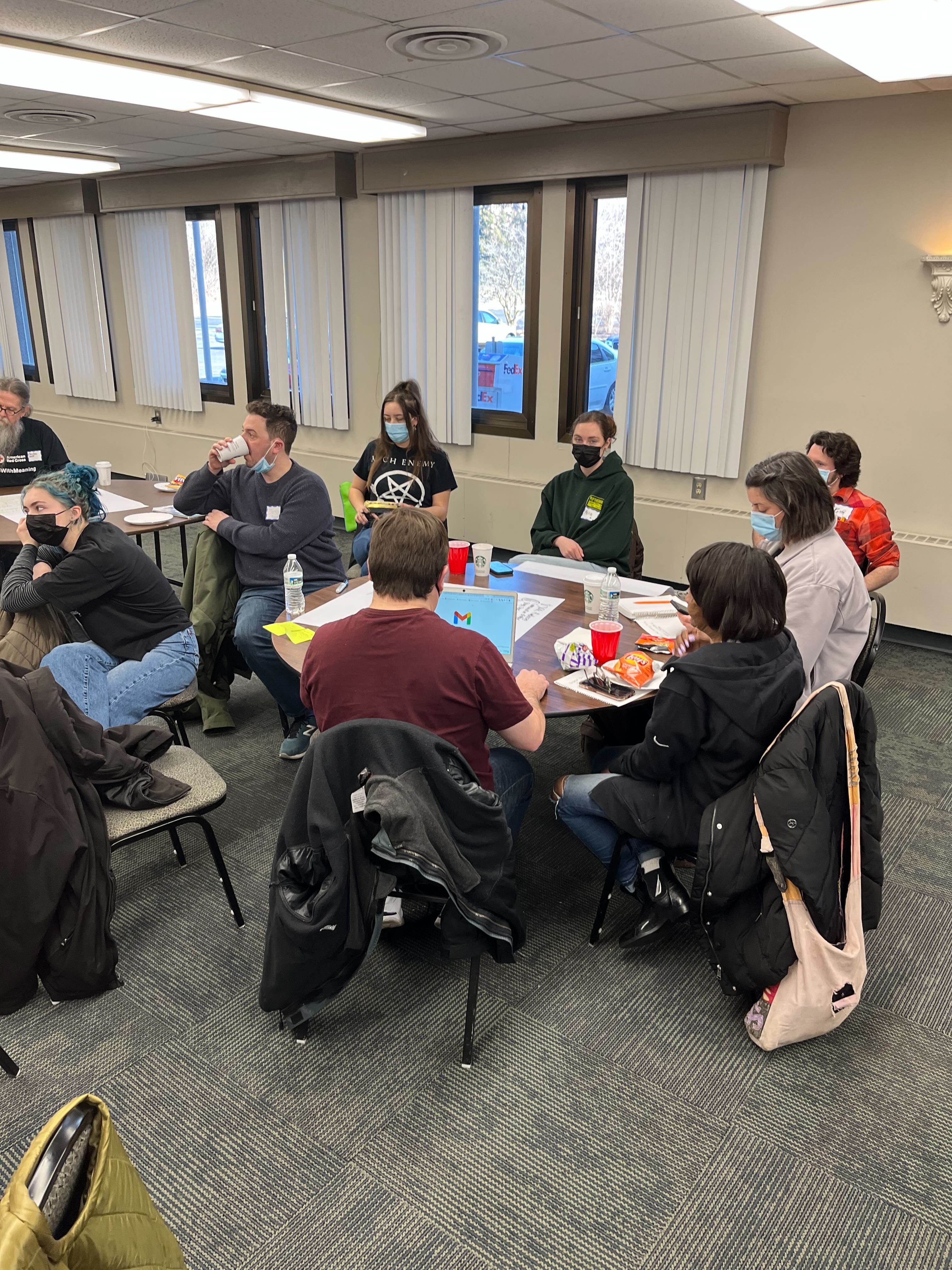 Photo of Jesse and supporters at an early team meeting and training 