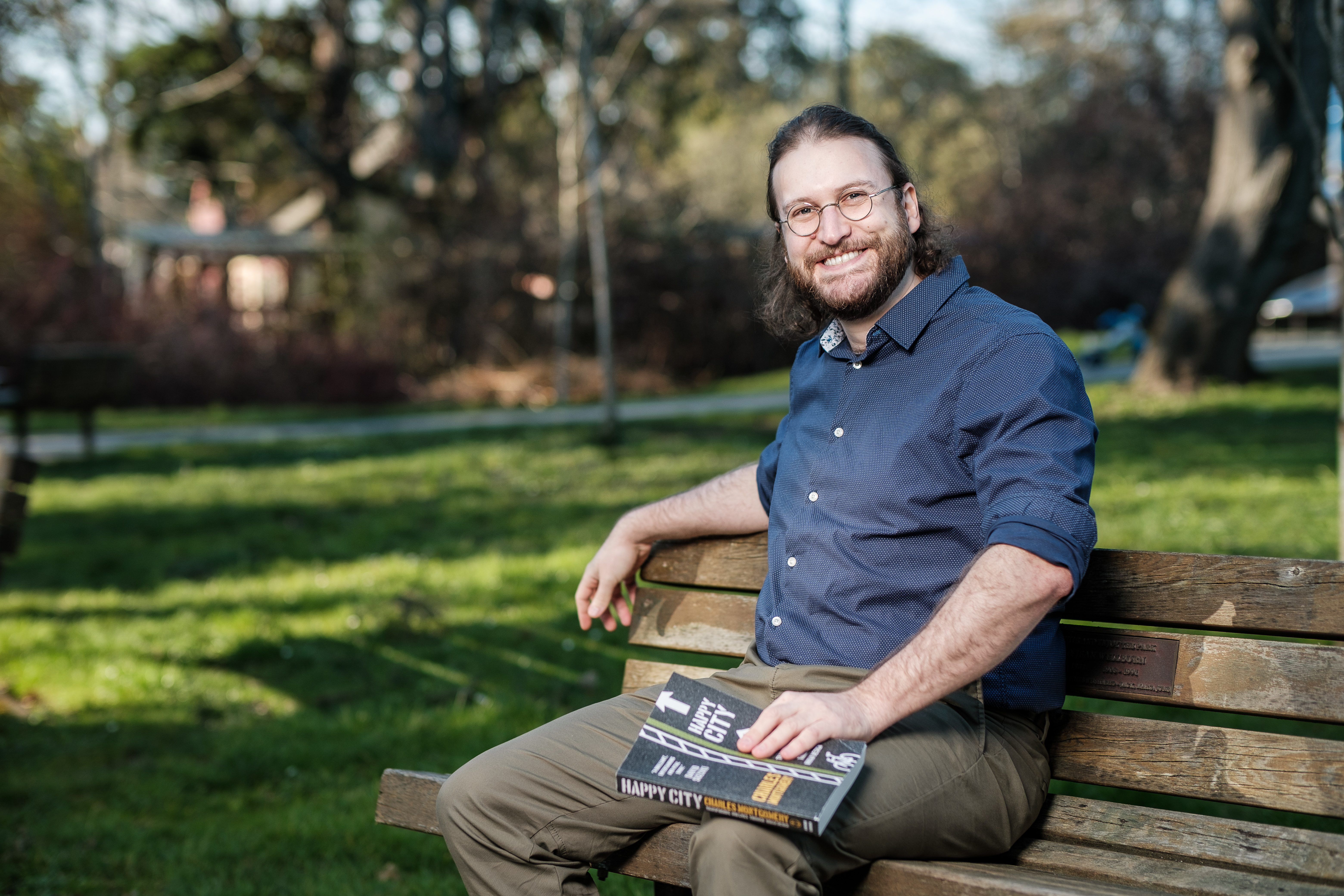 Teale Phelps Bondaroff sitting on a bench