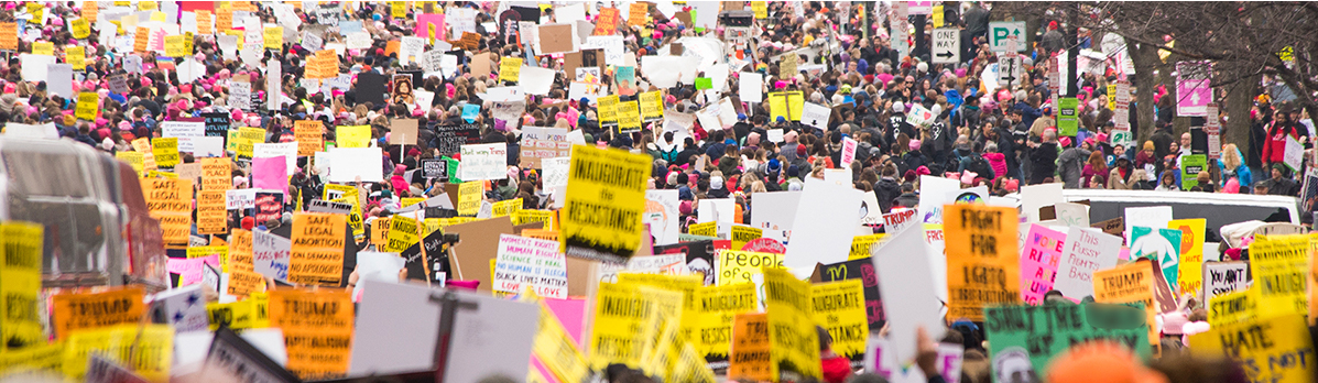 People with signs in a protest march