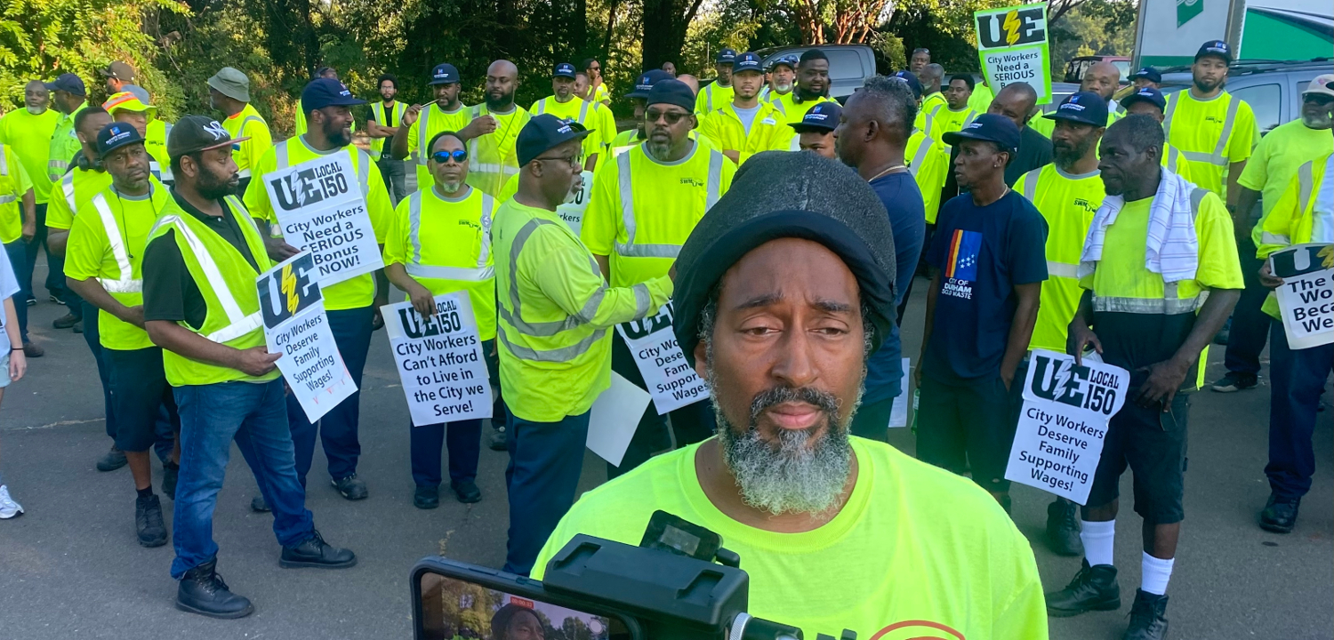 Durham solid waste services workers with signs reading City Workers Deserve Family Supporting Wages and other slogans