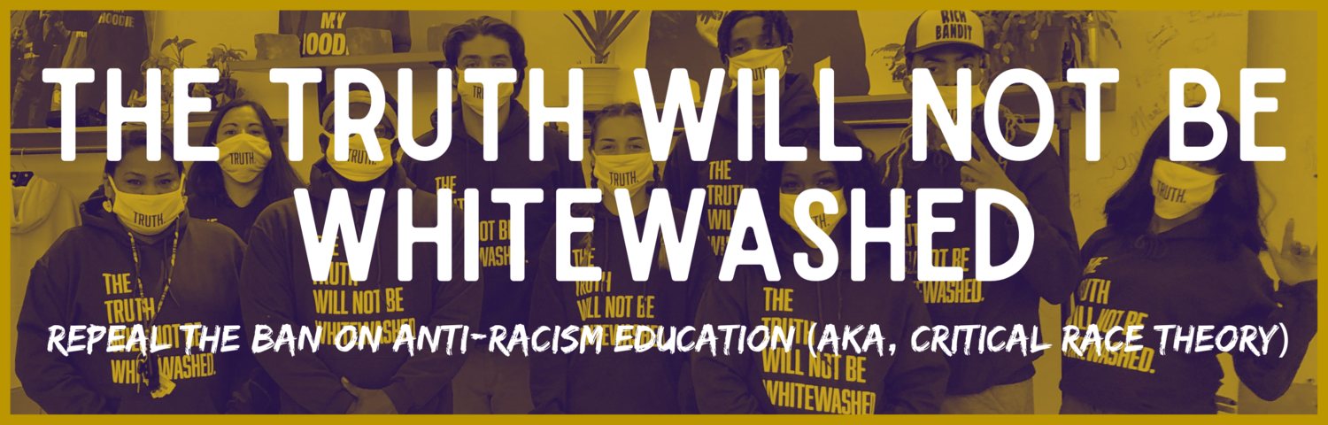 Great Plains Action Society and Humanize My Hoodie at the Black Liberation Space in Iowa city wearing "The Truth Will Not Be Whitewashed" hoodies.