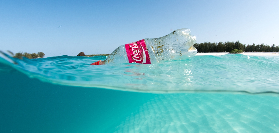 Plastic Coke bottle floating in the ocean, courtesy of NOAA