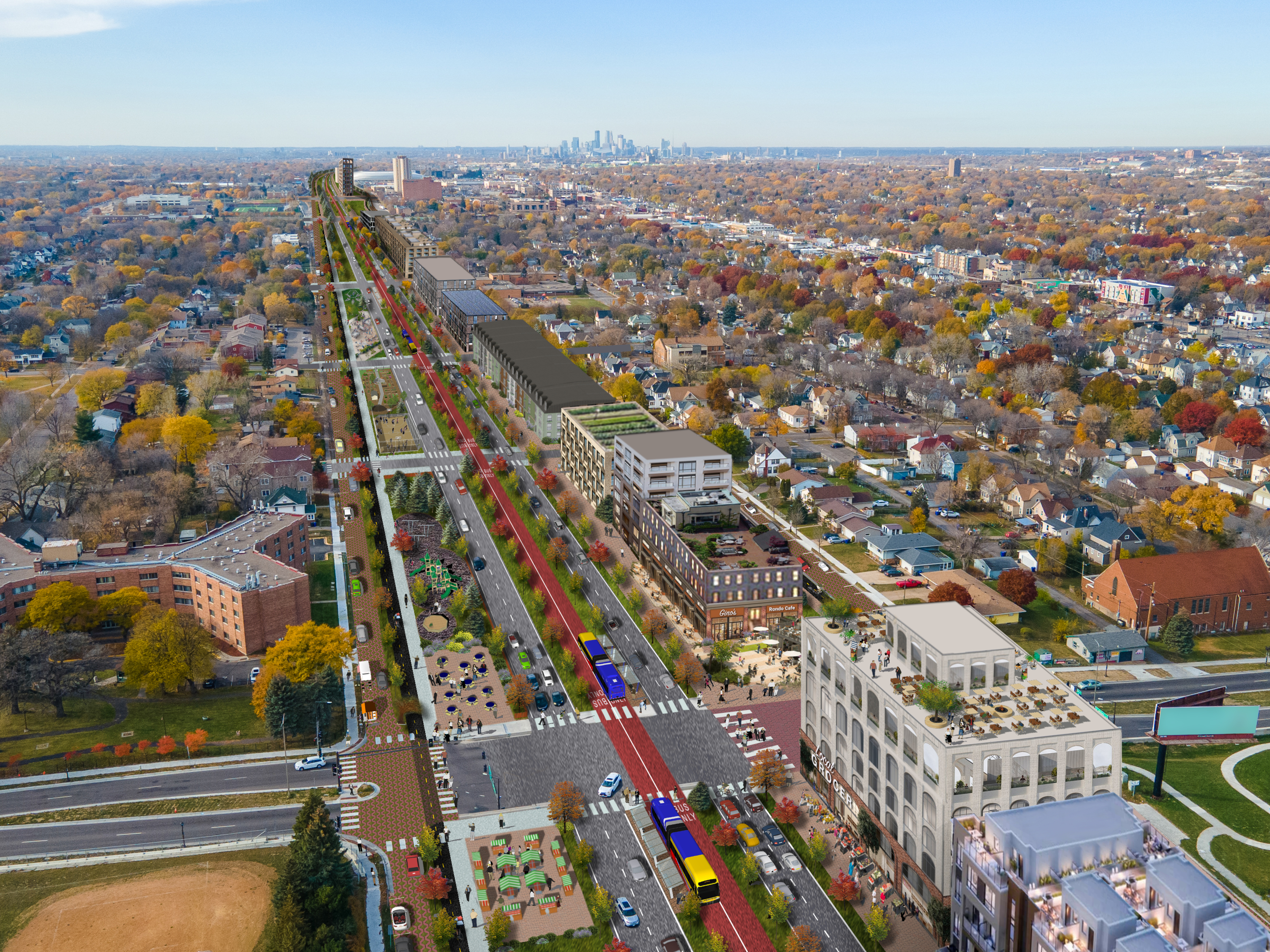 An aerial image in Saint Paul showing the Twin Cities Boulevard in what used to be the I-94 trench. The rendering shows traffic lanes, a busway, bike lanes, a linear park, sidewalks and new buildings.