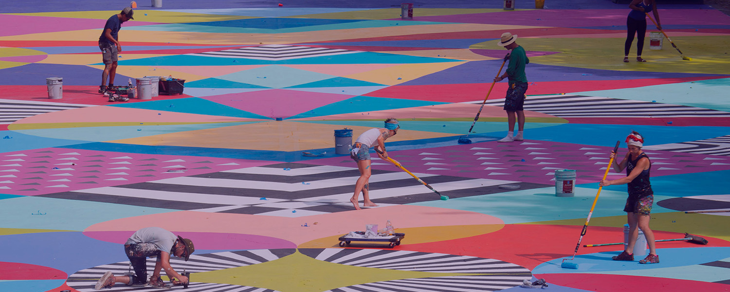 image of artists painting asphalt