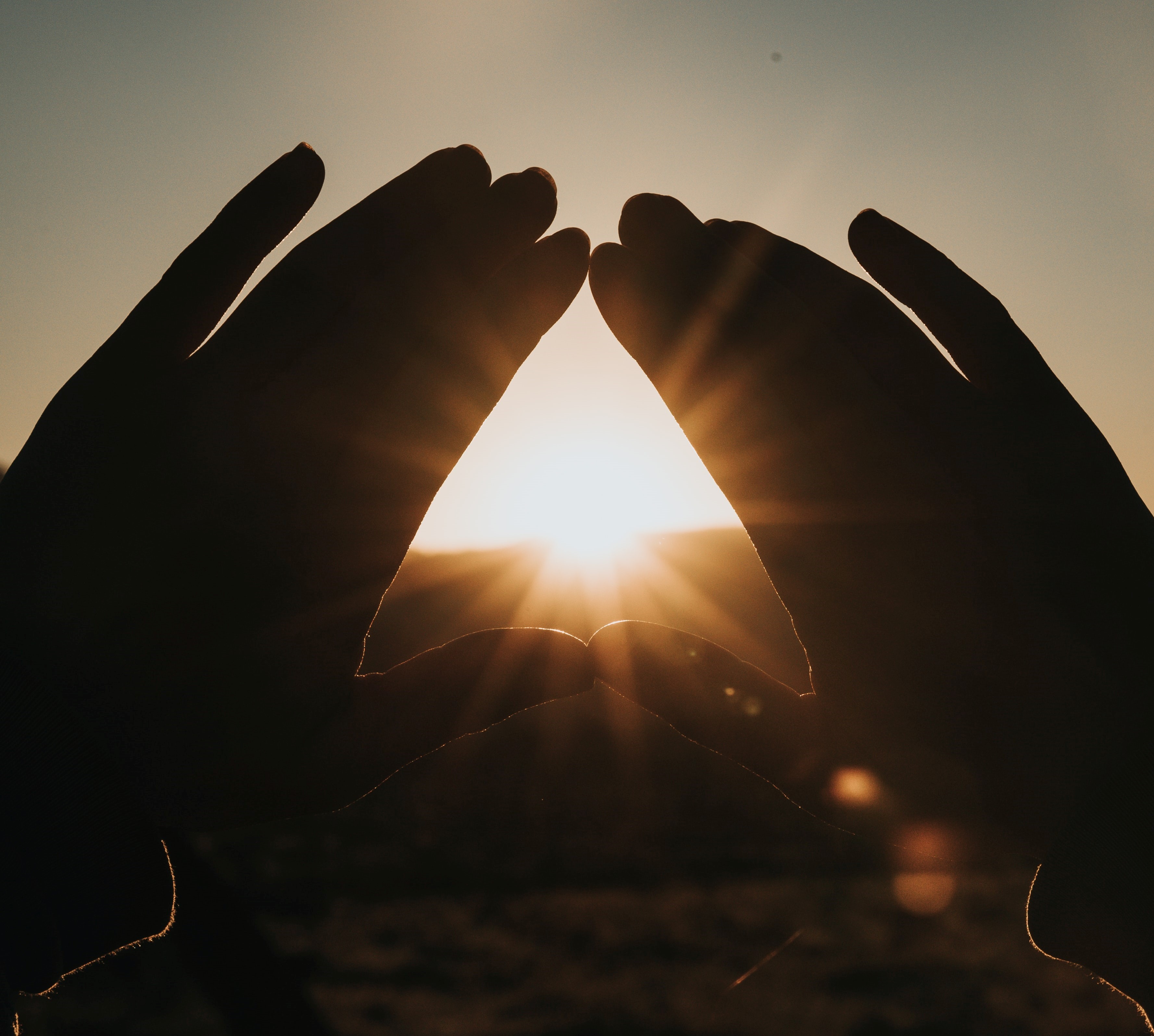 Beach background at sunset with sunshine rays extending