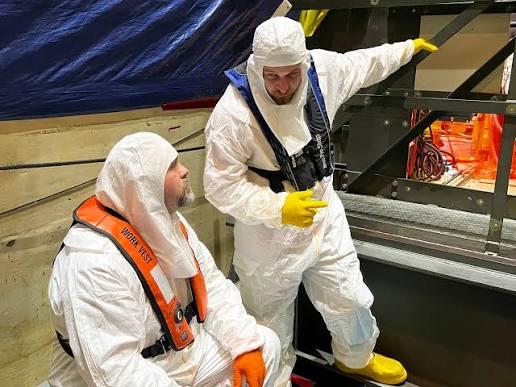 Nuclear Workers in protective gear
