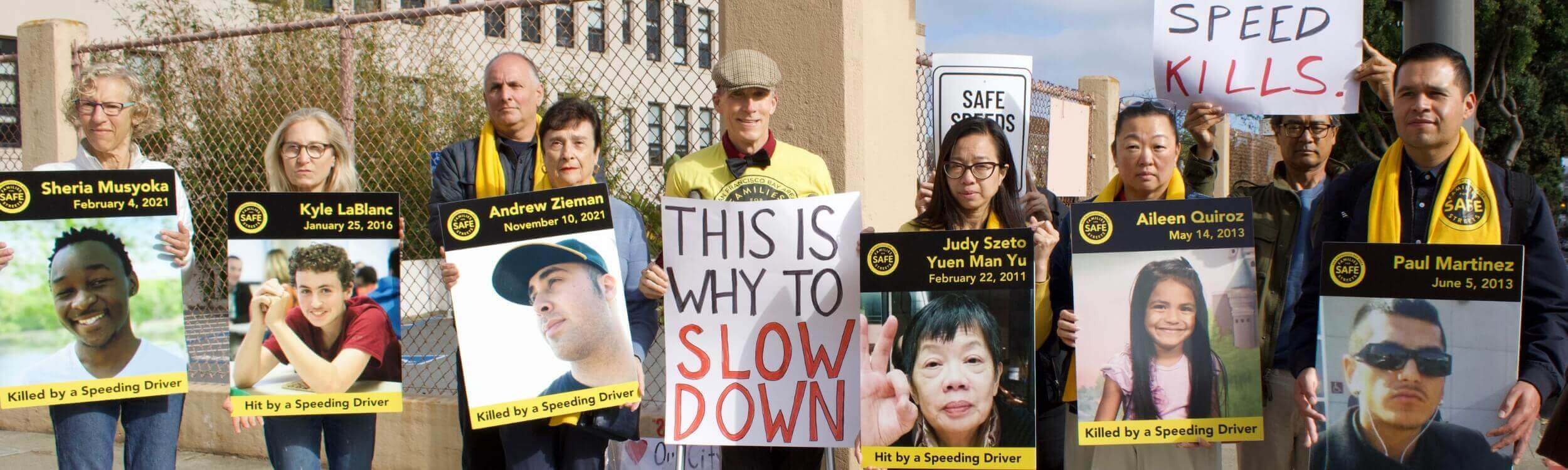 An image of the Bay Area Families for Safe Street members holding signs to slow down drivers