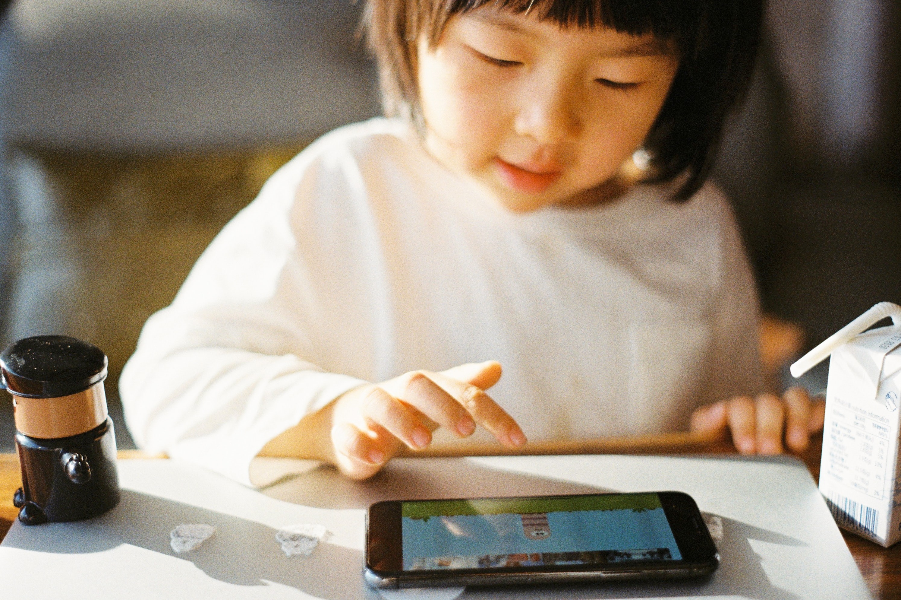 Child plays on tablet