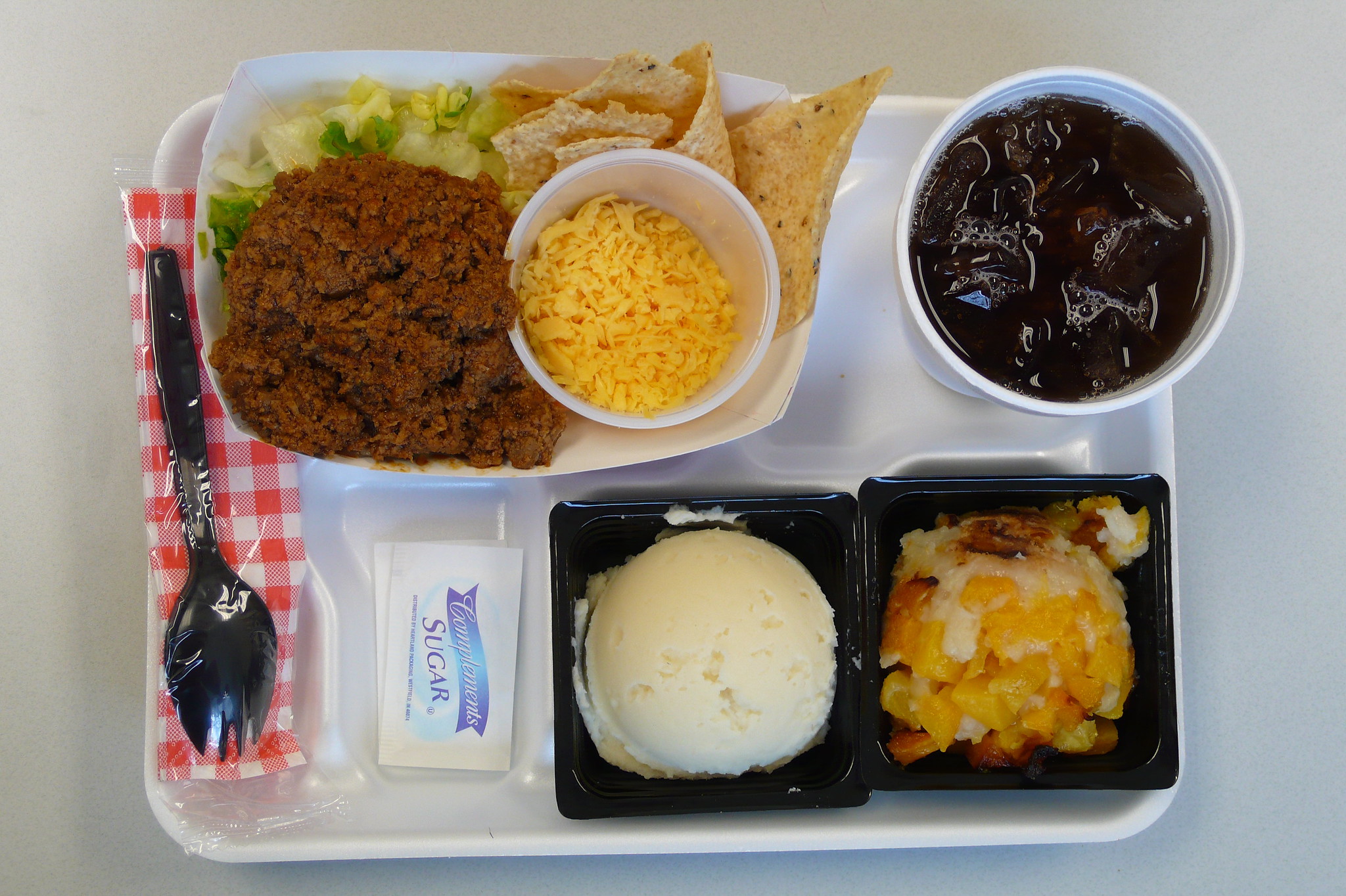 a school lunch from a cafeteria on a tray 