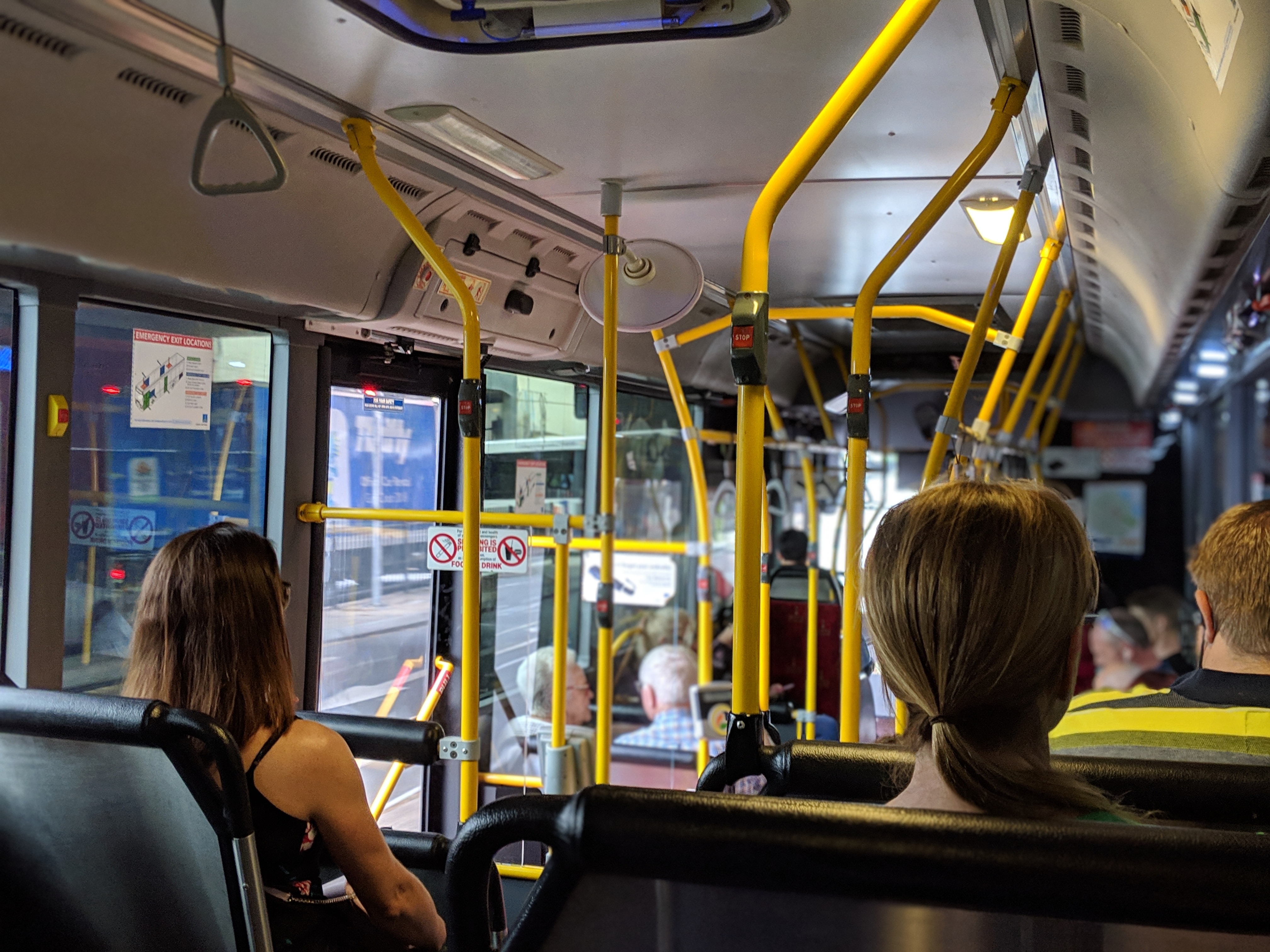Image of people riding a bus