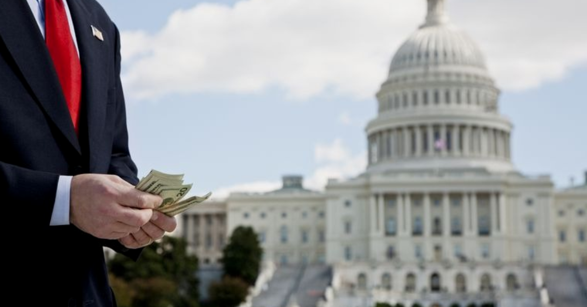 Image of a man holding cash with the Capitol building in the background