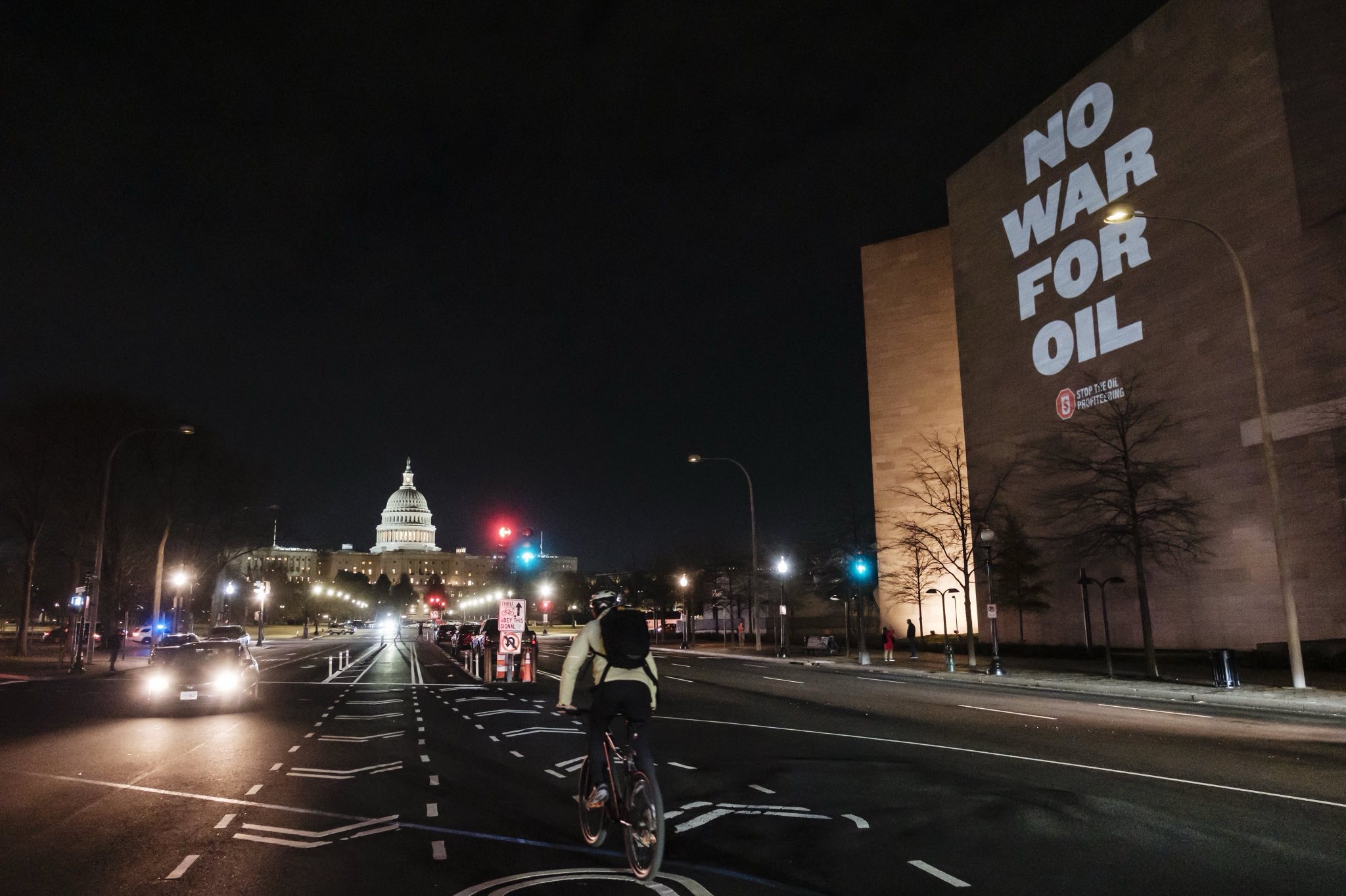 Activists project No War for Oil in DC
