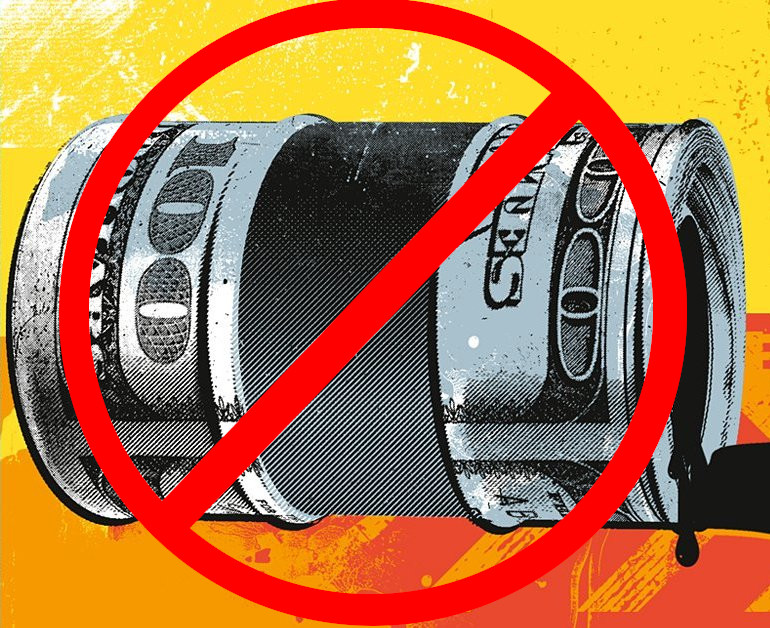 An oil barrel, with a dollar bill design on it, with a clear red cross through it showing oil proffits are not welcome