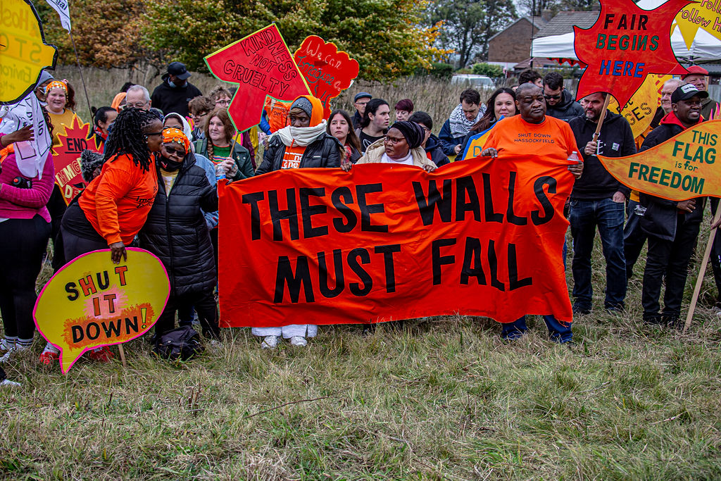 These Walls Must Fall banner on protest at Derwentside detention centre 2025