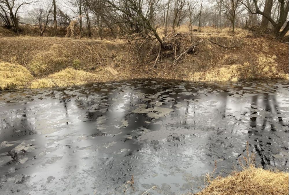 Black tarsands coats Mill Creek at Keystone Pipeline spill site (Photo: U.S. EPA)