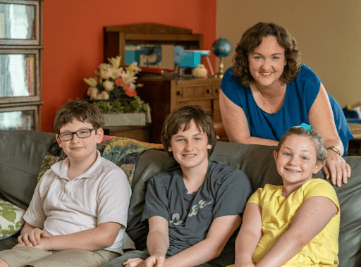 Photo of Katie smiling with her kids