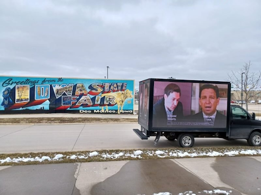 The DNC's mobile billboard showcasing Ron DeSantis's disastrous stance on Social Security and Medicare outside of his Des Moines, IA event.