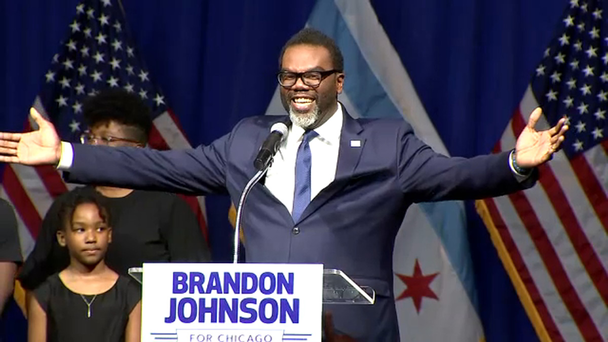 Photo of Brandon Johnson on stage about to address supporters at his victory party in Chicago