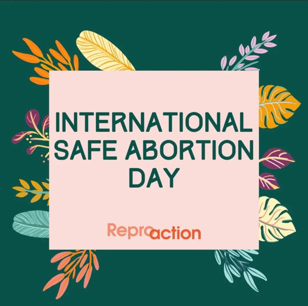 On a dark green background there is a pink box surrounded by leaves and flowers says “International Safe Abortion Day” the Reproaction logo is underneath in orange