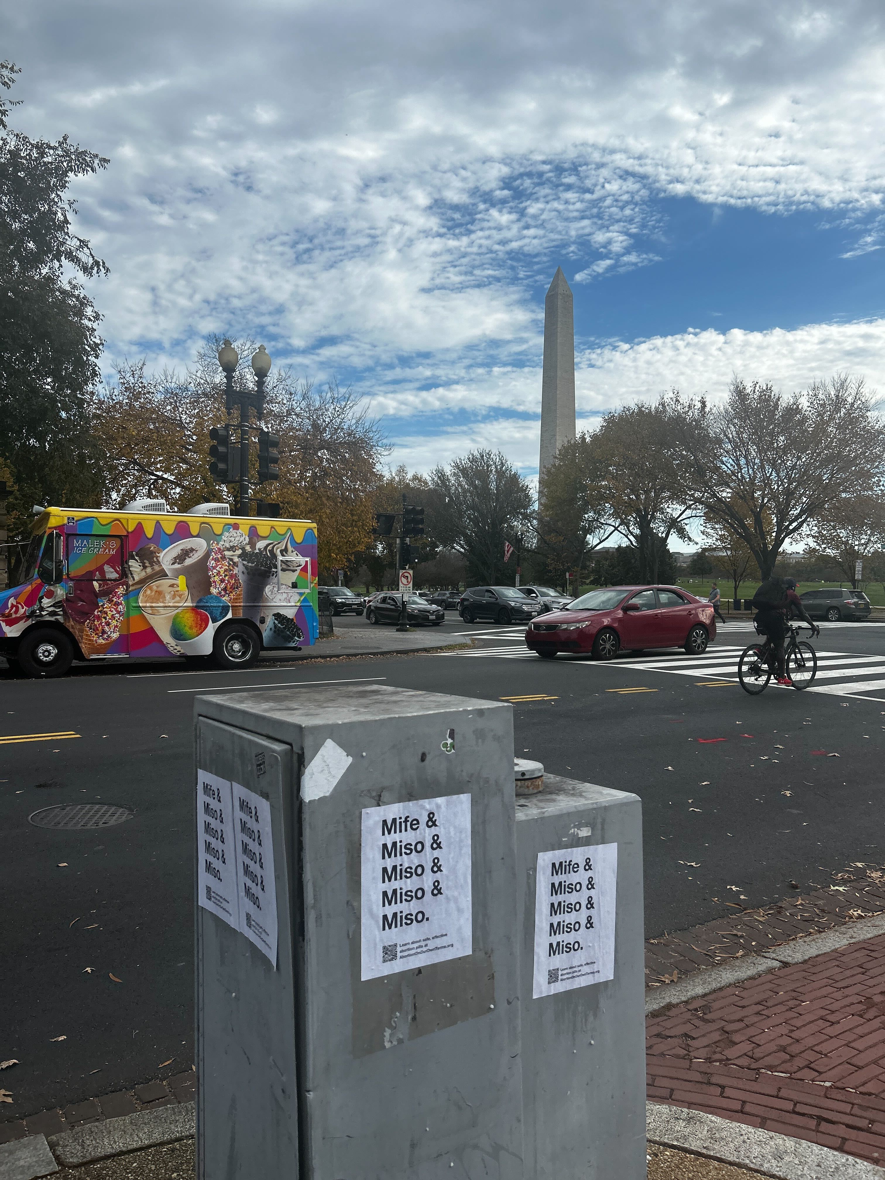 Picture of a poster saying "Mife & Miso & Miso & Miso & Miso | #AbortionOnOurOwnTerms" with the Washington Monument in the background.