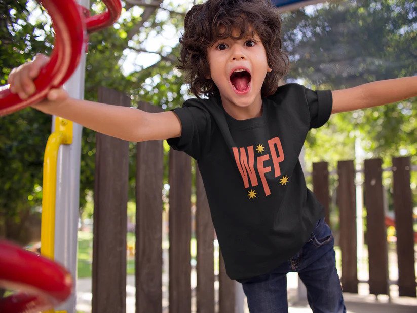 Photo of child in WFP youth tee