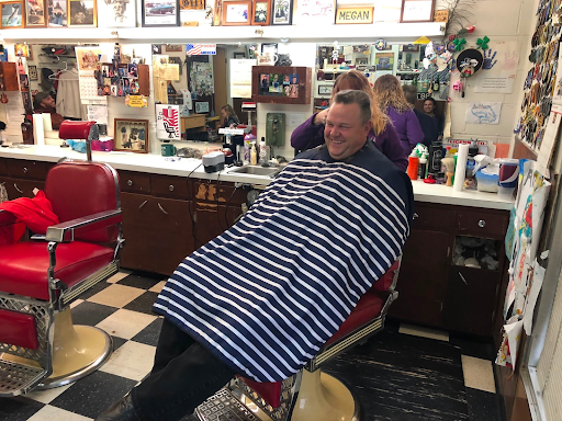 Sen. Jon Tester getting a hair cut