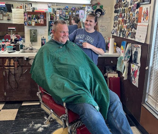 Sen. Jon Tester getting a hair cut
