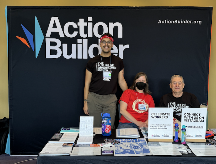 The Action Network & Action Builder booth at Labor Notes. From left: Dayan, Martha, and Mark from Action Network.