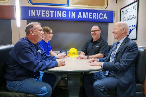 Joe Biden sitting at a table on an Amtrak train