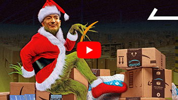 Image of Jeff Bezos's face photoshopped onto the Grinch, as he appears to tiptoe past many boxes of Amazon packages