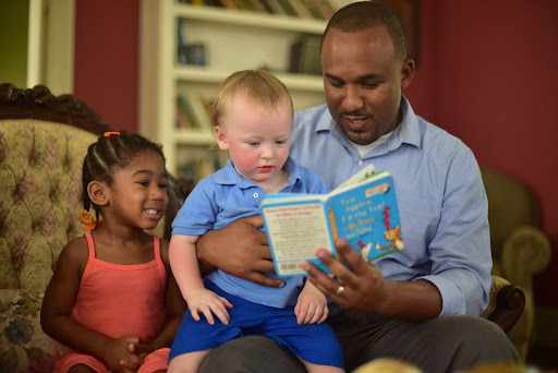 Scott Colom reading to children