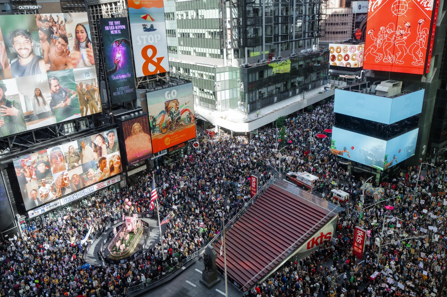 Photo of massive crowd at No Kings Day rally in Times Square.