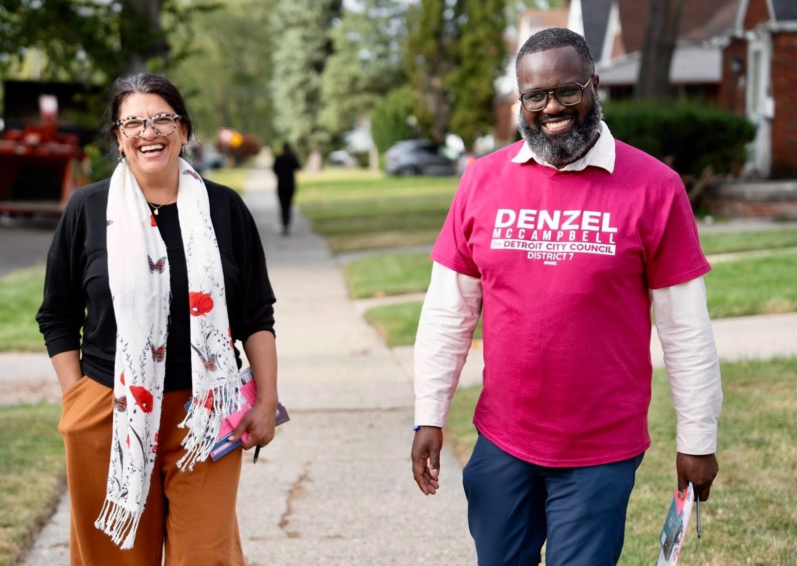 Rashida and Denzel walk a neighborhood canvassing to talk to voters