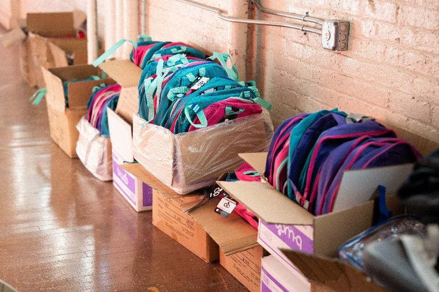A row of boxes filled with school supplies