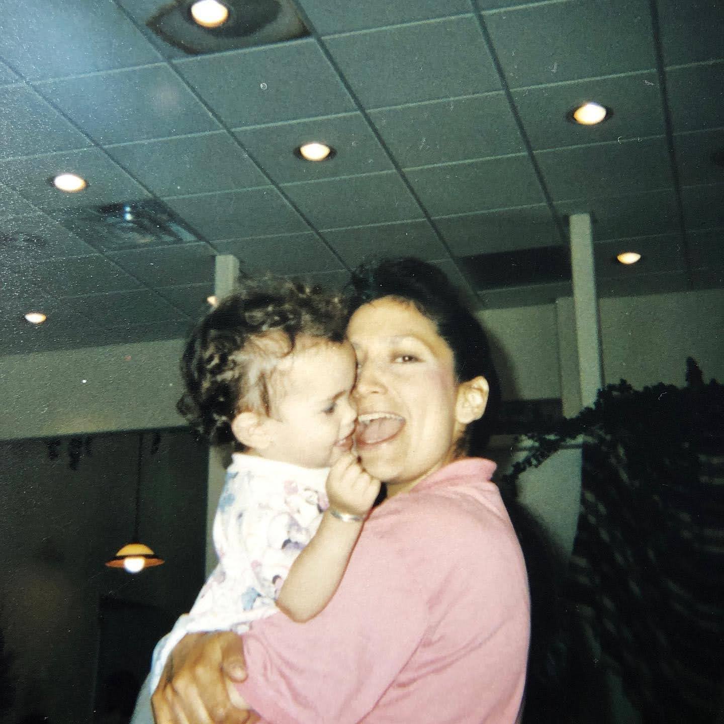 Old photo of Deb Haaland and her child