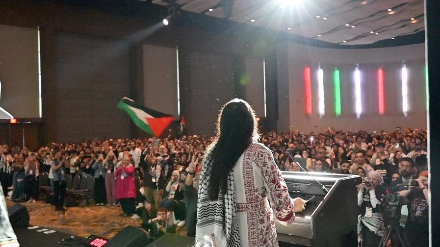 Rashida addresses a group of pro-Palestinian activists 