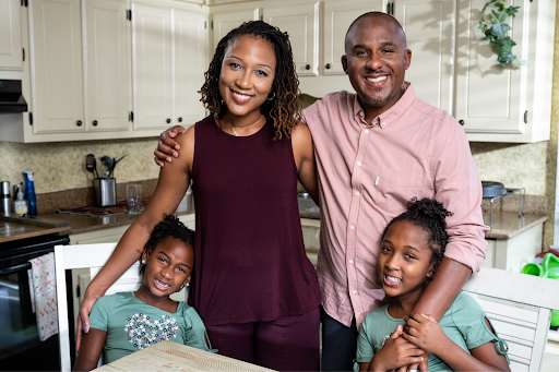 Family photo including Scott, his wife, and his two daughters