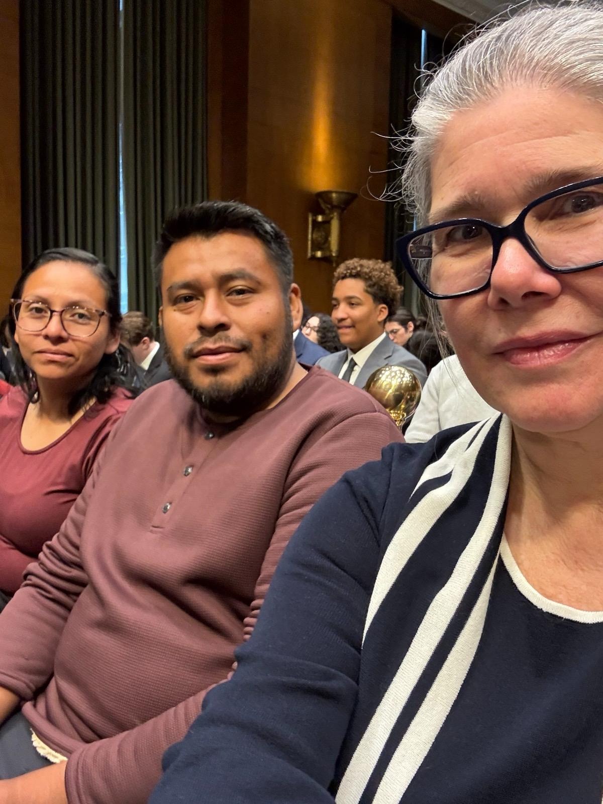 Families sit in the audience with Noelle from the Workers Circle