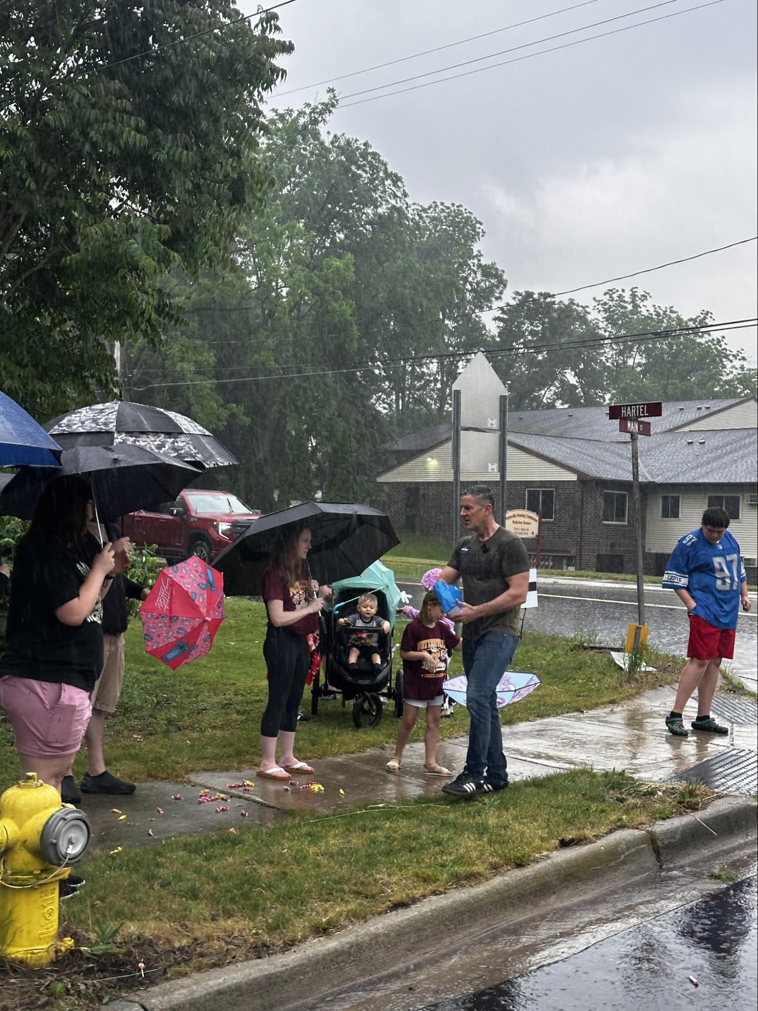 Matt and his Team in the rain talking to voters at an Independence day parade Matt and his Team in the rain talking to voters at an Independence day parade
