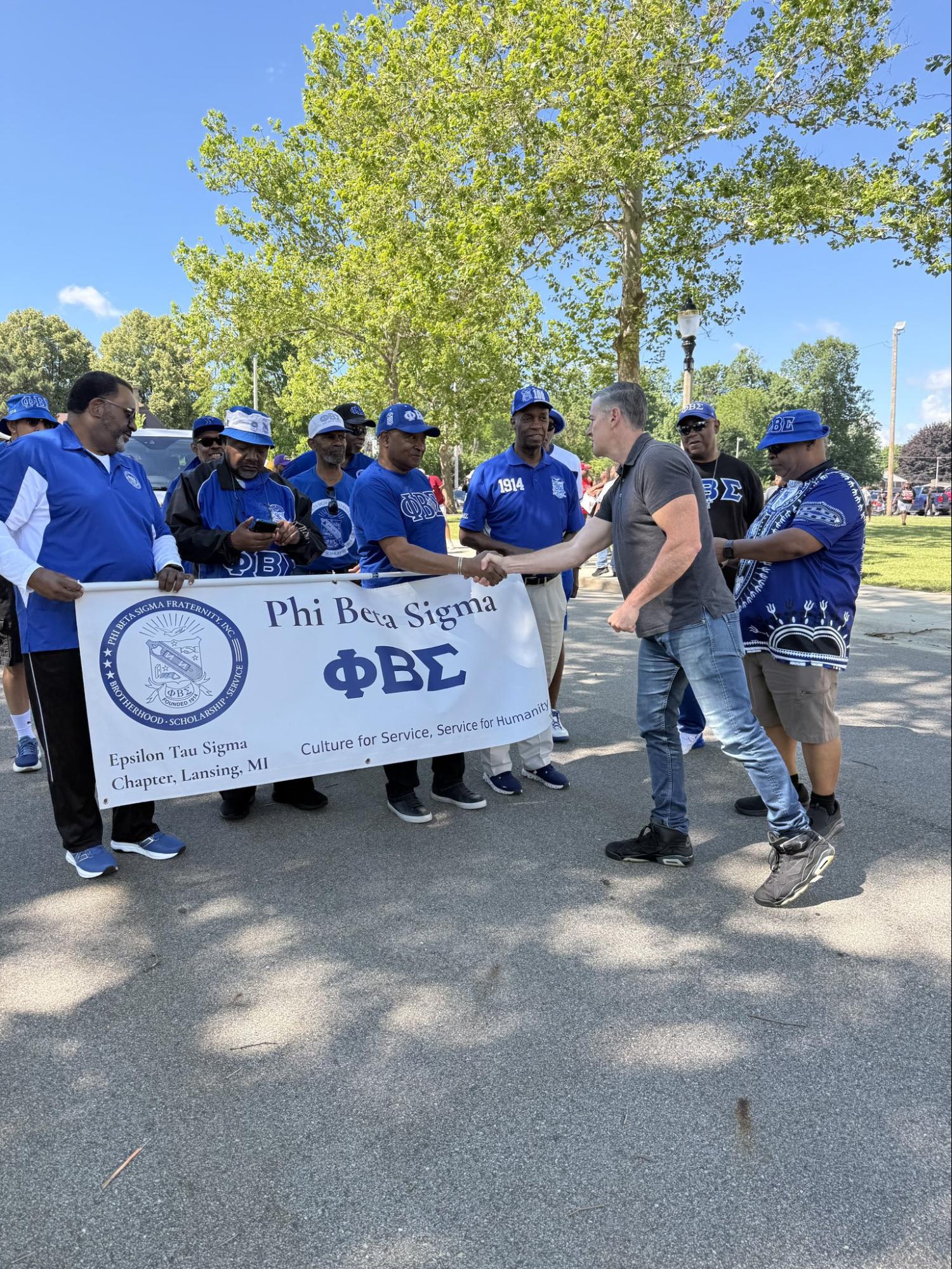Matt shaking hands with represetnatives of Phi Beta Sigma, Lansing CHapter Matt shaking hands with represetnatives of Phi Beta Sigma, Lansing CHapter