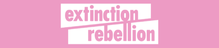 Extinction Rebellion outlined in white on a pink background 