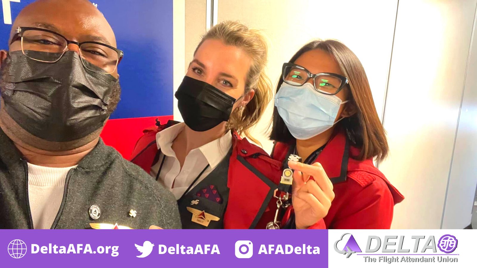 Three Delta flight attendants wearing masks and union pins.