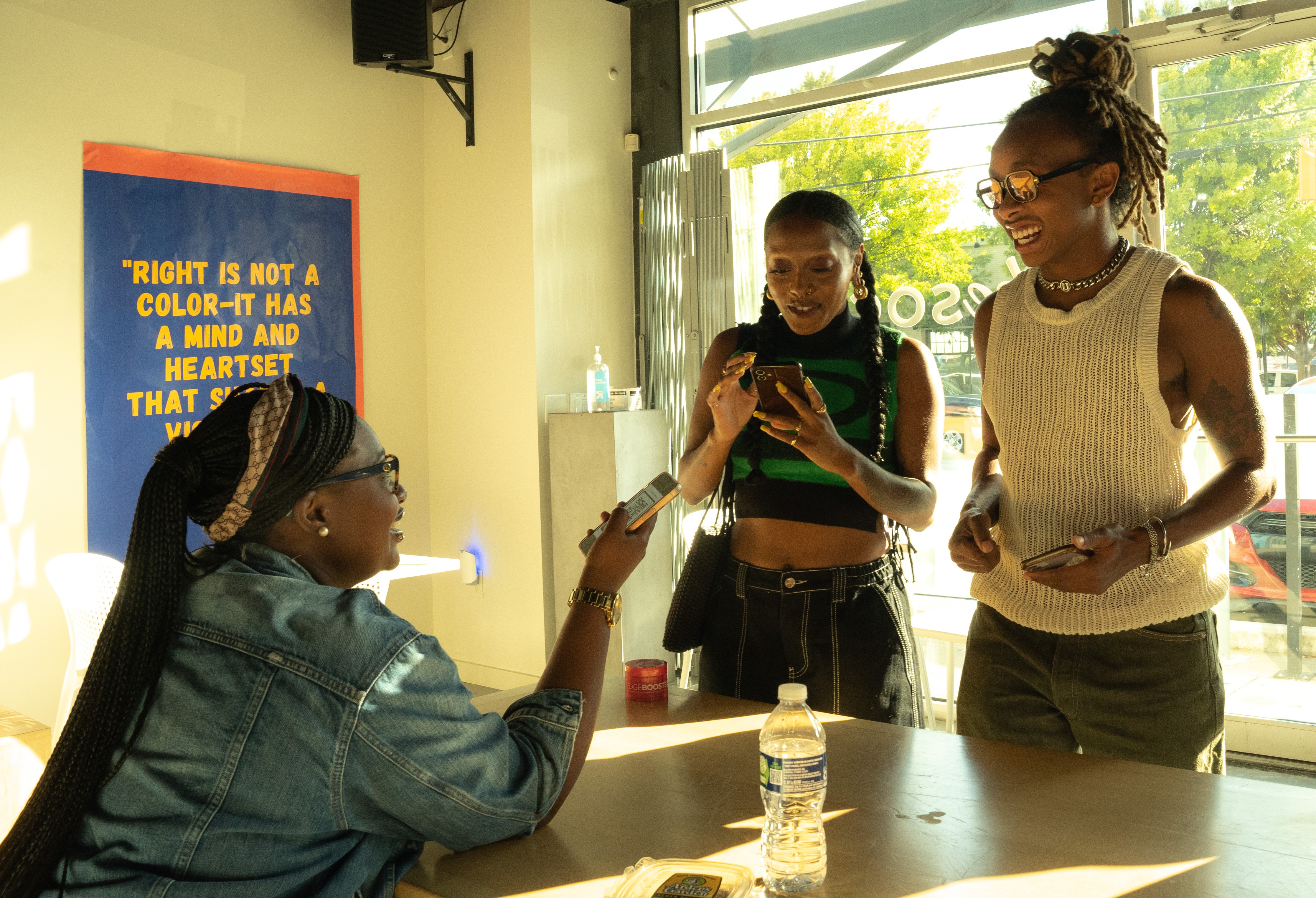 An organizer from our Youth Voter Coalition educates two young voters.