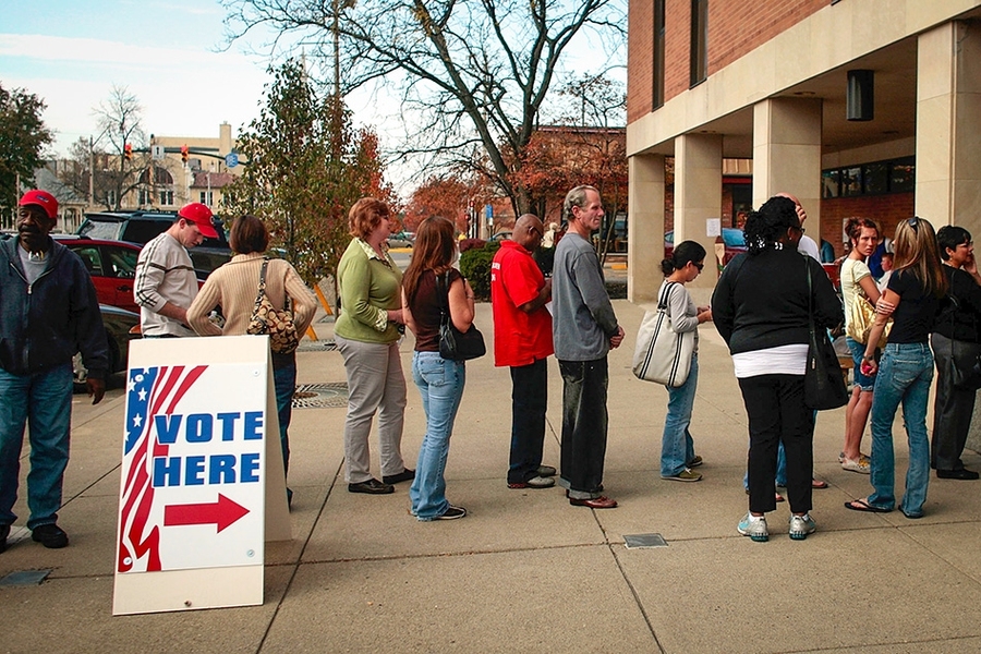 Voters wait in line to cast their ballots.