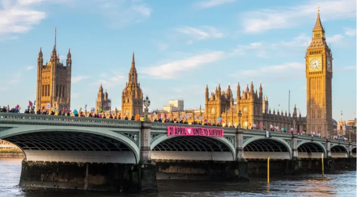Photograph of Westminster bridge with Unite to Survive banner drop