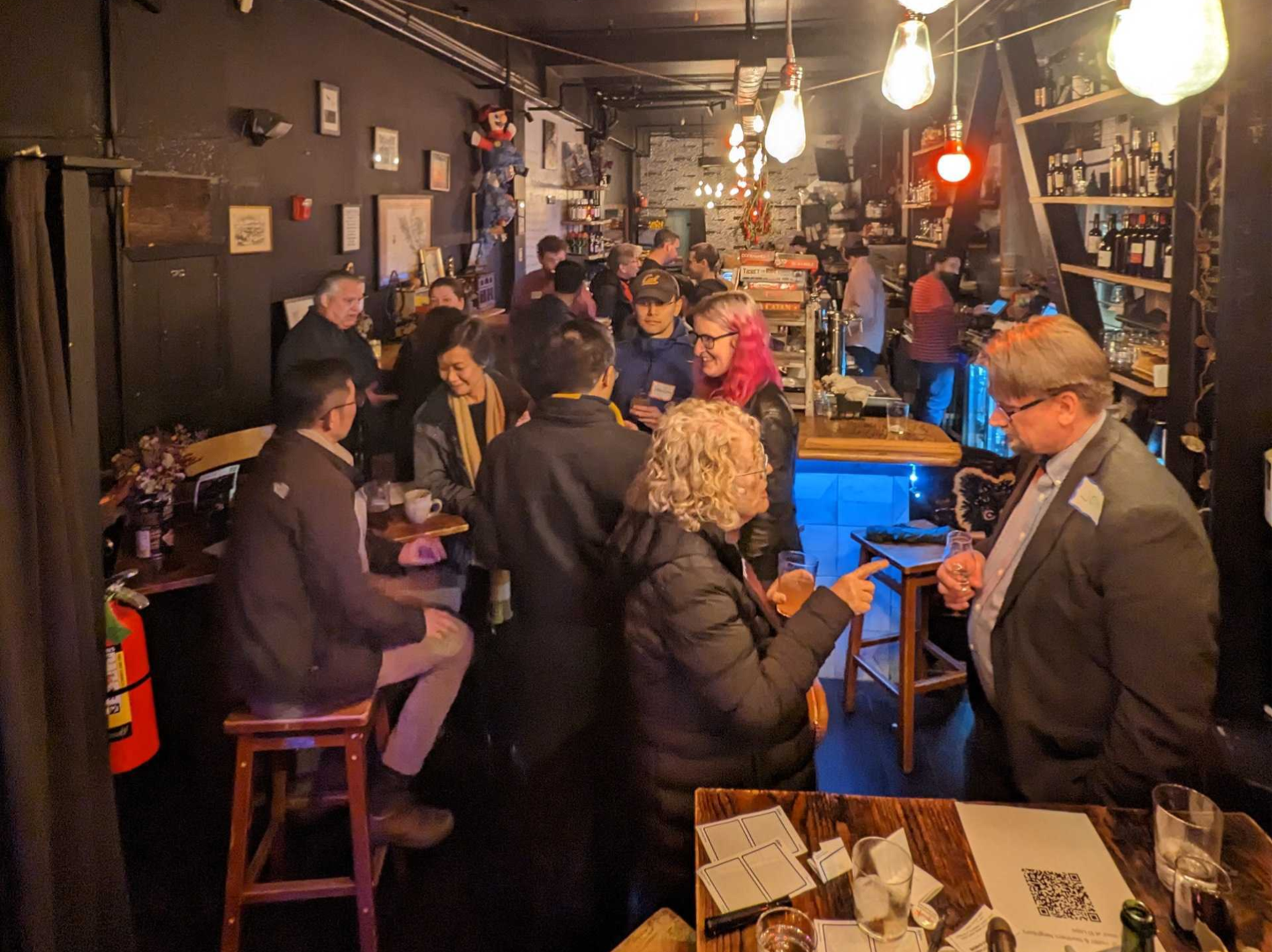 YIMBY members talking to each other at a Februrary happy hour social in February