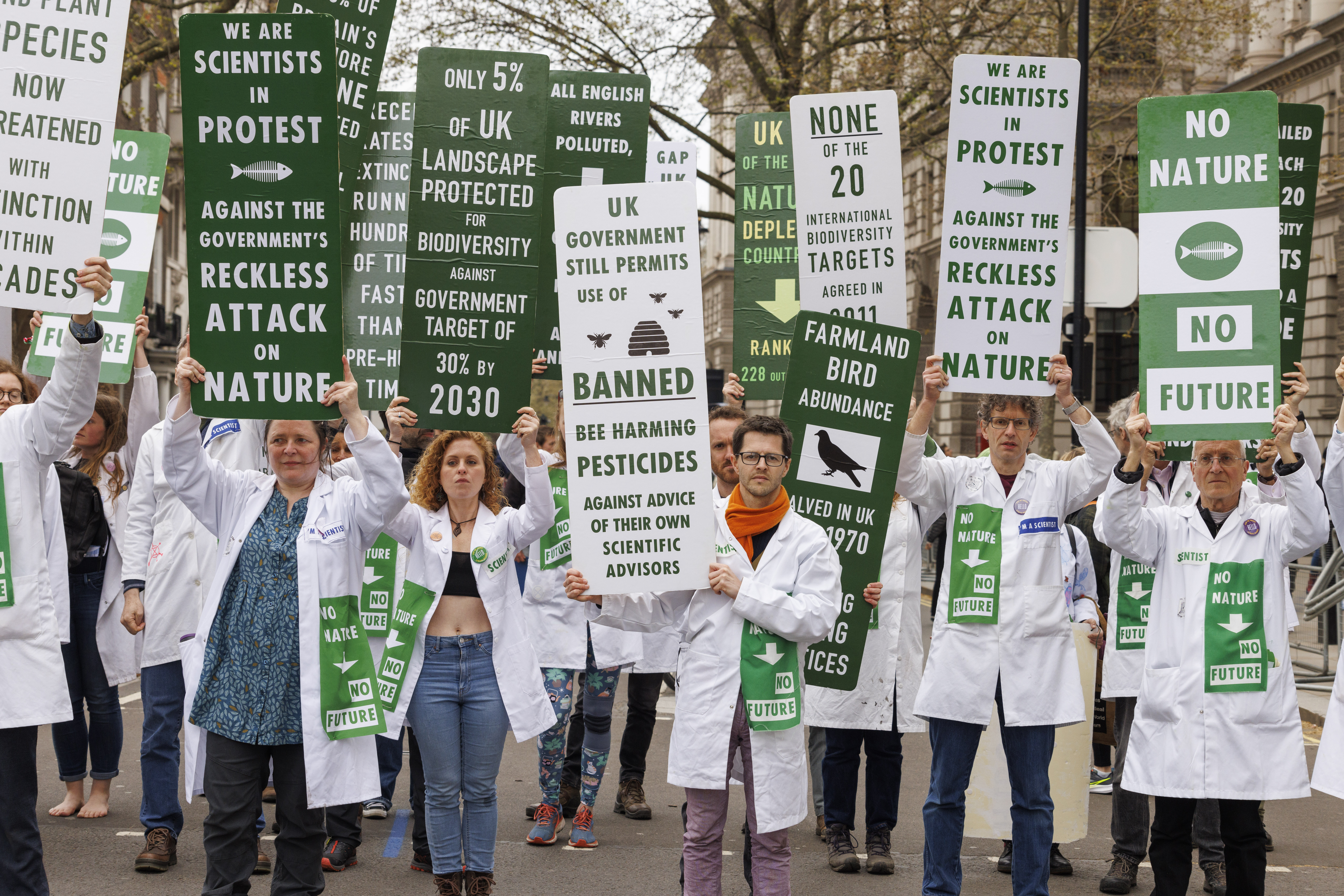 Photo showing a group of scientists holding placards