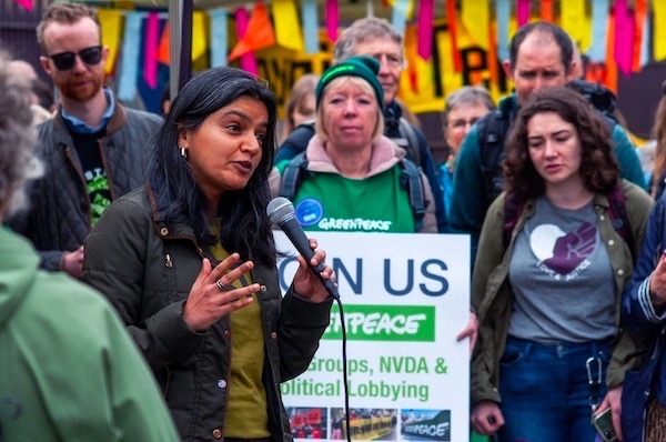 Photo of a person speaking to a crowd